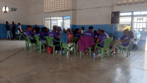 a group of women human rights defenders sitting discussing issues they are facing during international womens day